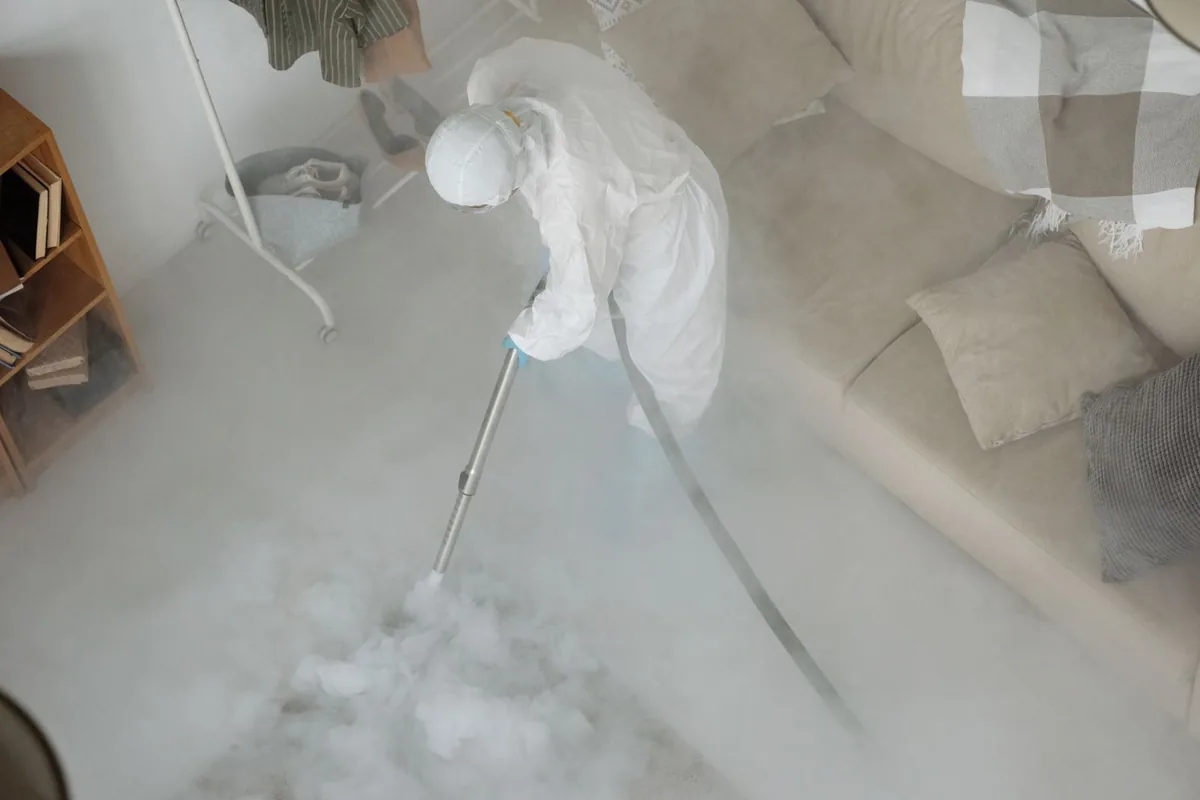 Biohazard cleanup technician in protective equipment, Watsontown, PA